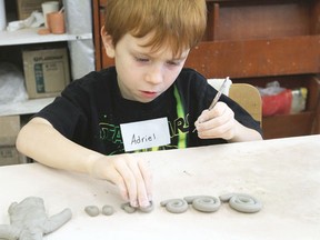 Adriel Taylor practices making coils at a pottery lesson at the crafts centre in Wetaskiwin Jan. 19, 2013. SARAH O. SWENSON/WETASKIWIN TIMES/QMI AGENCY