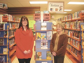Calmar library director Kim Johnson and staffer Carol Nystrom in the newly redesigned and updated Calmar Public Library.