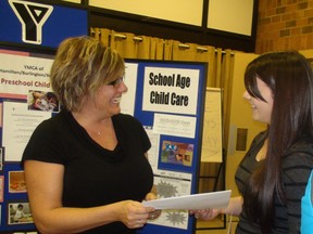 Dawn Waddington of the YMCA of Hamilton-Burlington-Brantford (left) discusses job prospects with ECE student Nicole Brayshaw at the second annual Early Childhood Educator and Education Fair at the Early Years Centre: Brant on Thursday. (MICHAEL-ALLAN MARION The Expositor)