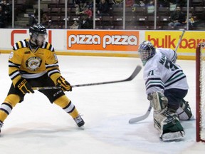 Plymouth Whalers goalie Matt Mahalak makes a glove save on a breakaway by Sarnia Sting forward Bryan Moore in OHL action Friday, Jan. 25, 2013 at the RBC Centre in Sarnia, Ont. PAUL OWEN/THE OBSERVER/QMI AGENCY