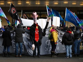 A man dressed up to represent Ontario Premier Dalton McGuinty poses during a protest in front of the old Maple Leafs Gardens where the Ontario Liberal leadership convention is being held in Toronto, January 26, 2013. REUTERS/Mark Blinch