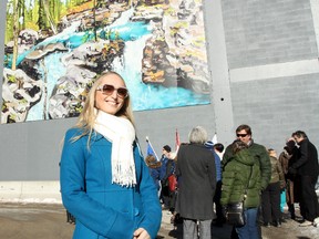 Artist Sheila Kernan stands in front of the large-scale reproduction of her painting, "When I Close My Eyes." The work is the latest piece of public art chosen for Banff, and it hangs on the outside of the Bear Street Mall. It was officially unveiled Saturday, Jan. 26, 2013. LARISSA BARLOW/ BANFF CRAG & CANYON/ QMI AGENCY