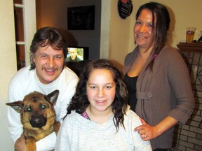 Twelve-year-old Jaylynn Graham is recovering well from an ordeal that landed her in a Jamaican intensive care unit.  She still requires a daily visit from a nurse but is back at school. With Jaylynn is her dog Storm, father Corey Graham and mother Melinda Plain. They say they are grateful that the Sarnia community helped with their expenses at a time of crisis. (CATHY DOBSON, The Observer)