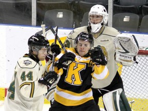 Kingston Frontenacs' Darcy Greenaway and London Knights' Dakota Mermis get their sticks up in front of goalie Anthony Stolarz during Ontario  Hockey League action at the K-Rock Centre on Sunday.  (Ian MacAlpine/The Whig-Standard)
