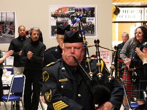Pipe Major Tom Luke, of the Timmins Police Pipes and Drums, leads the traditional piping of the haggis during Saturday night’s Robbie Burns Day gala at the McIntyre Auditorium.
