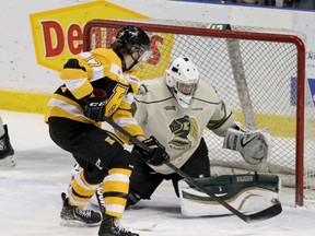 Ryan Kujawinski of the Kingston Frontenacs gets a chance on London Knights goalie Anthony Stolarz during the Knights’ 3-2 win in Kingston on Sunday.  (IAN MACALPINE, QMI Agency)