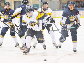 EDDIE CHAU Simcoe Reformer
Simcoe Junior C Storm forward Clayton Chalmers is chased by members of the Dunnville Mudcats during first period of play Sunday night at Talbot Gardens. In both teams' last regular season game, Dunnville defeated Simcoe 3-2.