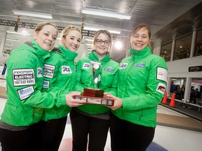 Amber Cheveldave (left), Michelle Dykstra, Blaine de Jager and Kristie Moore of Grande Prairie’s Team Moore pose with their trophy after winning the championship game of the Alberta Scotties Tournament of Hearts in Lethbridge Sunday afternoon over fellow club mate Renee Sonnenberg in an extra end. The Grande Prairie-based team will now represent Alberta in Kingston at the Scotties Tournament of Hearts in February. See Sports for full details. (David Fuller/ Special to the Herald-Tribune)