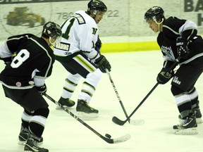 Two of the top teams in the North West Junior Hockey League met for the fifth and final time this season at the Baytex Energy Centre in Peace River on Friday January 25, 2013. The Grande Prairie JDA Kings beat the North Peace Navigators 5-4 in a back and forth affair. Pictured, Kings defenseman Dustin Gould (left) takes the puck away from Navigators forward Bond Hawryluk in the second period . The Kings host the Fort St. John Huskies on Tuesday.
LOGAN CLOW/PEACE RIVER RECORD-GAZETTE/QMI AGENCY