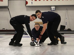 Simon Barrick, left, Wes Forget and Scott Chadwick compete in the semifinals at the Whig-Standard Bonspiel at the Royal Kingston Curling Club on Saturday. (Danielle VandenBrink/The Whig-Standard)