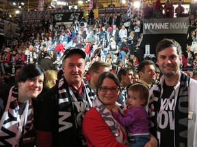 SUBMITTED PHOTO   Inside Maple Leaf Gardens, Renfrew-Nipissing-Pembroke riding delegates Maggie Conway (left), Barry Robinson, Meredith Caplan Jamieson (along with her daughter) and Derek Nighbor cheer on their candidate, Kathleen Wynne, who will become Ontario's next premier.