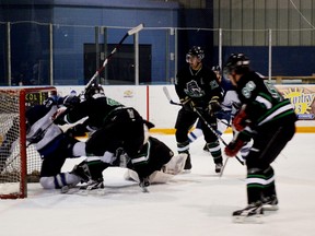 The Saugeen Shores Winterhawks defeated the Ripley Wolves during their last regular season game at The Plex on Saturday evening. The scoring went back and forth, but the Winterhawks never gave up coming out on top with a 7-3 win, securing their second place position in the WOAA North Division. In the first round of playoffs, the ‘Hawks will be facing the Mapleton-Minto 81’s. Pictured above: Brent MacDermid takes one for the team as he gets pushed into the net by the Ripley defense. Unfortunately in all the scrambling, the puck was in the net, but the goal was called off.