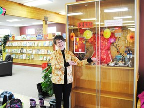 Leann MacKinnon, assistant librarian for the Whitecourt and District Public Library, prepares the library’s display for their next special event, Chinese New Year.
Barry Kerton | Whitecourt Star