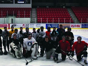 Bantom Tier 1 players, coaches and Cold Lake Ice Members mix together for a grand old photo.  Ice players this week have been helping out at the practices for all Minor teams, in honour of Minor Hockey Week.