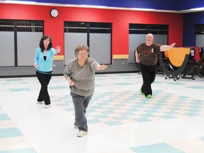 John Horn (r), puts Bridgett Sheppard (left) and Jane Elsinger (middle) through a pattern during Fung Loy Kok Institute of Taosim’s Tai Chi class on Jan. 21 at the St. Joseph School cafeteria.
Barry Kerton | Whitecourt Star