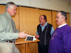 Haldimand Norfolk MPP Toby Barrett; left discusses his white paper entitled Paths to Prosperity: Welfare to Work with chief executive officer of Community Living Tillsonburg; Marty Graf (right, back) and president of People First Tillsonburg; Don Skiba (right, front) during a forum held in Tillsonburg on Friday at the Livingston Centre. The forum included representatives from service providers, community organizations such as the Salvation Army and recipients of Ontario Works and ODSP, who came together to discuss recommendations made in a final report on social assistance review, released last fall. 

KRISTINE JEAN/TILLSONBURG NEWS/QMI AGENCY