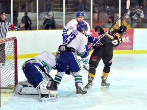 Sudbury Nickel Barons defenceman Brett Dusick, shown here giving Abitibi Eskimos forward Peter Poulin-Roy a tough time in front of the Sudbury net during a game played in Cochrane earlier this season, is tied for the NOJHL penalty minute lead with teammate Ryan Chretien. The Nickel Barons have each spent 69 minutes in the penalty box. Dusick and his Sudbury teammates will visit the Jus Jordan Arena Saturday night. The Eskimos host the Soo Thunderbirds at the Archie Dillon Sportsplex in Timmins on Friday.