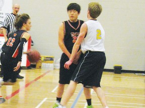 Wyatt Williams of the Mayerthorpe senior boys Tigers takes the ball down the court and around the Rebels of Holy Redeemer High School in Edson defence in a Sr. Strike Energy Service 2013 Invitational Tournament game at Hilltop High School on Friday, Jan. 24. Mayerthopre girls made it to the semi-final but were defeated 43-37. Mayerthorpe boys beat Beaverlodge 47-36 to win the consolation final.
Ann Harvey | Mayerthorpe Freelancer