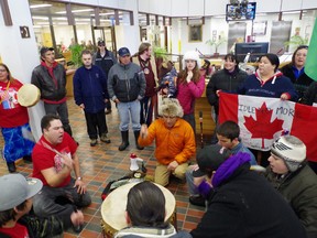 Protesters gather around drummers in the lobby of the Civic Centre.