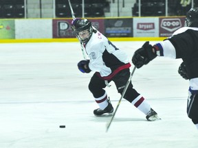 Caps defenceman Chad Millar takes a shot during a game earlier this year. (Kevin Hirschfield/PORTAGE DAILY GRAPHIC/QMI AGENCY)