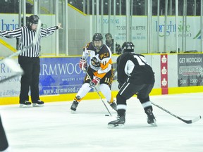 Trojans' AJ Thomson stickhandles the puck during a game last week. (Kevin Hirschfield/PORTAGE DAILY GRAPHIC/QMI AGENCY)