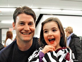 Former NHL player Boyd Devereaux with Elle Morton, 5, signed autographs during the fundraiser Ref4Rett and the Ontario Rett Syndrome Association at the Brant Sports Complex on January 26, 2013 before the Paris Mounties game. KARA WILSON/FOR THE PARIS STAR