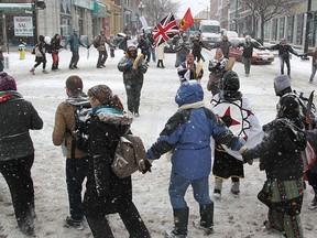 Supporters of the Idle No More movement block the intersection of Princess and King streets with a round dance during a march downtown to City Hall on Monday.
Michael Lea The Whig-Standard