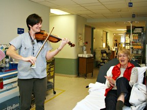Submitted Photo

Brantford General Hospital emergency physician Dr. Jill Wiwcharuk serenades Pat Kuyper, a patient in the emergency department.