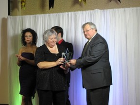Patti Albert of Chocolates and Candlelight receives her award for ‘Outstanding Service by an Individual’ at the 2013 Gold Star Awards and Gala on Sunday.
