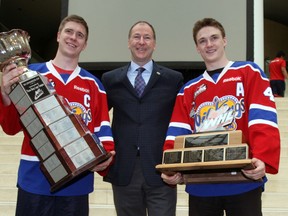 Edmonton Oilers president Kevin Lowe (c) poses with Oil Kings Captain Mark Pysyk (l) and Keegan Lowe as he city held a rally at City Hall in Edmonton, Alberta on May 29, 2012 to celebate the Oil Kings' WHL championship.