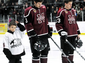 Declan Waddick celebrated his eighth birthday Sunday by joining the Chatham Maroons, including Branden Morris (3) and Evan Mascaro (23), for the national anthem. (Staff Photo)