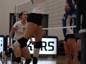 Brittany Ardron of the Nipissing Lakers sends the ball back over the net above a Niagara Knights block Sunday afternoon during OCAA women's volleyball action. The Lakers won the game in three straight sets.