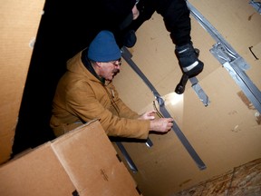 Terry Cassidy builds his shelter for Friday's Sleep Out! So Others Can Sleep In, held in the Quinte West city hall parking lot.
EMILY MOUNTNEY/TRENTONIAN/QMI AGENCY