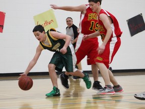 Troy Taylor (left) with the MUCC junior boys basketball team played against the LP Miller Bears during a MJIT game this past weekend. The MUCC Comets junior boys team claimed first in the tournament.