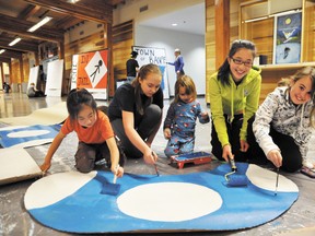 Banff skaters paint mushrooms on Sunday, Jan. 27 at the Fenlands in preparation for the Saturday, Feb. 2 ice skate show called What Game Do You Want to Play? CORRIE DIMANNO/BANFF CRAG & CANYON/QMI AGENCY