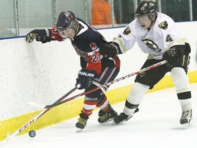 Wetaskiwin’s Dallas Graham and Strathcona’s Tanner Kress battle for the puck along the boards during a game at the Civic Centre Jan. 26.