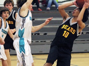 Christian Santiago gets one past LGMS on Friday, Jan. 25 during their home tournament. The Bears ended in fourth place. Larissa Barlow/ Banff Crag & Canyon