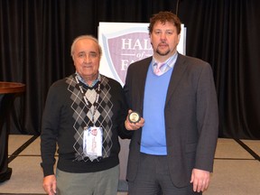 Sarnia’s David Craievich, right, recently was inducted into the East Coast Hockey League (ECHL) Hall of Fame. Craievich, 41, was invited to Colorado Jan. 23 for an induction ceremony. He operates Craievich Financial Services on Christina Street with his brother Paul. SUBMITTED PHOTO