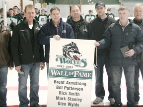 The Ripley Wolves held a special Wall of Fame night on Friday, Jan. 25, 2013 before their 7-3 win against the Shelburne Muskies. The first five members of the Wall were honoured in a pregame ceremony where they were presented plaques and shown the banner that will be hoisted to the rafters. On hand for the ceremony were (L-R) Dwight Irwin, Vice President of the Wolves executive, honorees Brent Armstrong, Bill Patterson, Mark Stanley, Mark Smith accepting on behalf of his father, Rick Smith) Glen Wylds, and executive member Brian Colling. (JOHN F. ADAMS/KINCARDINE NEWS FREELANCE)