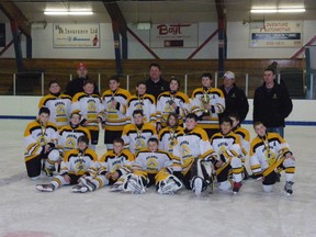 The Fairview Sharp Thunder Pee Wee and coaching staff holding their silver medals after their final game in the Ken and Teena Smith memorial invitational pee wee hockey tournament. Player Cole Basnett (far right) can be seen holding the award for Most Valuable Player. (Courtesy: Sharp Thunder team)