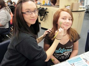 MONTE SONNENBERG Times-Reformer
Cosmotology was among the skills on the agenda during the three-day Techxploration program at Holy Trinity High School in Simcoe this week. Experimenting with theatre paint Tuesday were Tiffany Garcia, left, a student at Holy Trinity, and Brittney Parchen, a Grade 8 student at St. Joseph’s School.