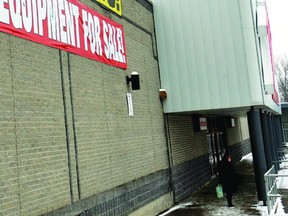 A Zellers shopper waits for a companion outside the store on Tuesday. Zellers will close March 30, just a few months short of operating in Brockville for 50 years. (DARCY CHEEK/The Recorder and Times)