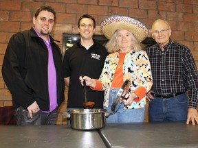 The top three vote getters at the third annual Paris Optimist Chili Cook-off on Saturday, Jan. 26, 2013 were the second place Cobblestone Pub, represented by owner Matt Cummings, left, first place winner Camp 31, represented by manager Rob Yurkiw, and third place winner Paris Community Policing, represented by Edith Stone and Murray Powell. MICHAEL PEELING/THE PARIS STAR/QMI AGENCY