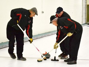 Bruce Waechter, John MacAulay and Tom Marcotte giving it all they had to knock out the Scotland rocks.