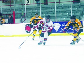 St. Thomas Aquinas forward Jackson Fregeau cuts in front of the Fort Frances Muskies net Tuesday night looking for an opening. The Saints scored a 5-3 win, their 15th straight victory.
LLOYD MACK/Daily Miner and News