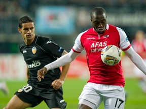 Valencia's Ricardo Costa fights for the ball with Jozy Altidore of AZ Alkmaar during their Europa League quarter final match at the AFAS-Stadium in Alkmaar, March 29, 2012. (REUTERS/Paul Vreeker/United Photos)