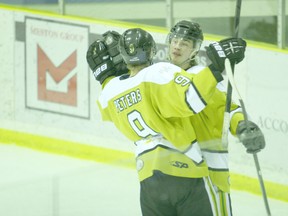 Logan Clow/R-G
North Peace Navigators frward Dutin Long (right) celebrates after scoring a goal against the Fairview Flyers on Saturday January 26, 2013 in Peace River as teammate Josh Peters congratulates him. The Record-Gazette recently caught up with Long, a Whitecourt native.