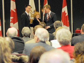 Adam Jackson/QMI Agency
Sylvia Johnson, middle, is awarded with the Queen Diamond Jubilee Medal by Grande Prairie Mayor Bill Given, left, and Peace River MP Chris Warkentin, right, at Teresa Sargent Hall inside the Montrose Cultural Centre Tuesday, Jan. 22, 2013 in Grande Prairie. Johnson was one of 50 recipients to be awarded the medal Tuesday evening.