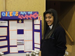 Student Sarah Abba shows off her project entitled “Oilers Beat the Flames” at Avonmore school on Jan. 24. Dale Boyd/Special to the Examiner