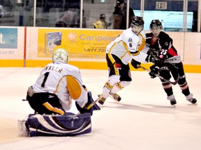 Defenceman Ryan Kerr, engaged with Soo Thunderbirds forward Gavin Burbach during a Dec. 15 game at the Jus Jordan Arena as goaltender Jackson Winkler makes a save, will be one of the Abitibi Eskimos trying to shut down the NOJHL-leading Thunderbirds when the visit the Archie Dillon Sportsplex Friday night.